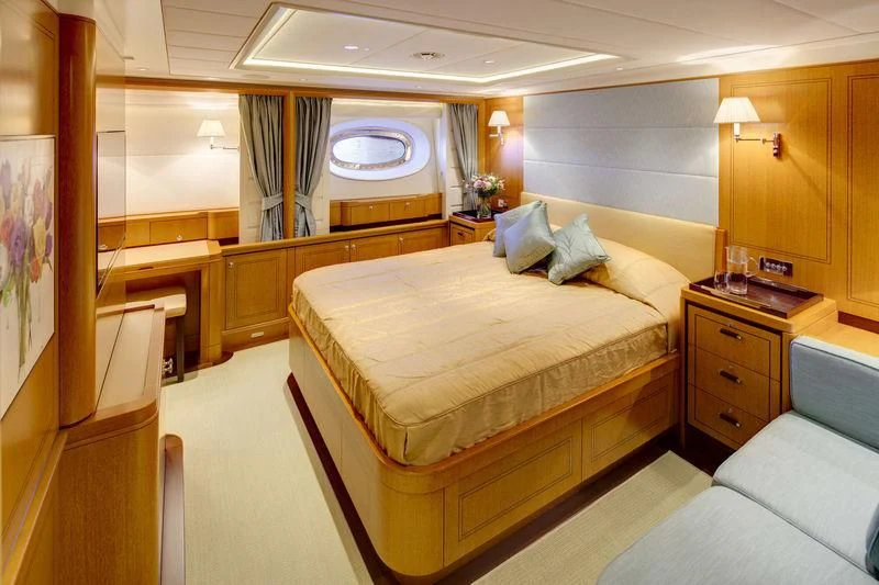 a room with a bed and a window aboard WISP Yacht for Sale