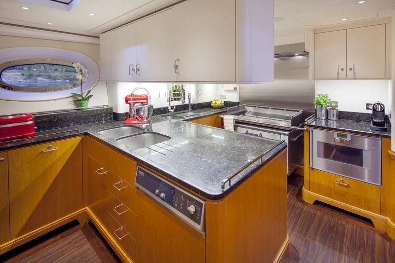 a kitchen with a large island aboard WISP Yacht for Sale