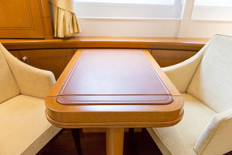 a wooden coffee table aboard WISP Yacht for Sale
