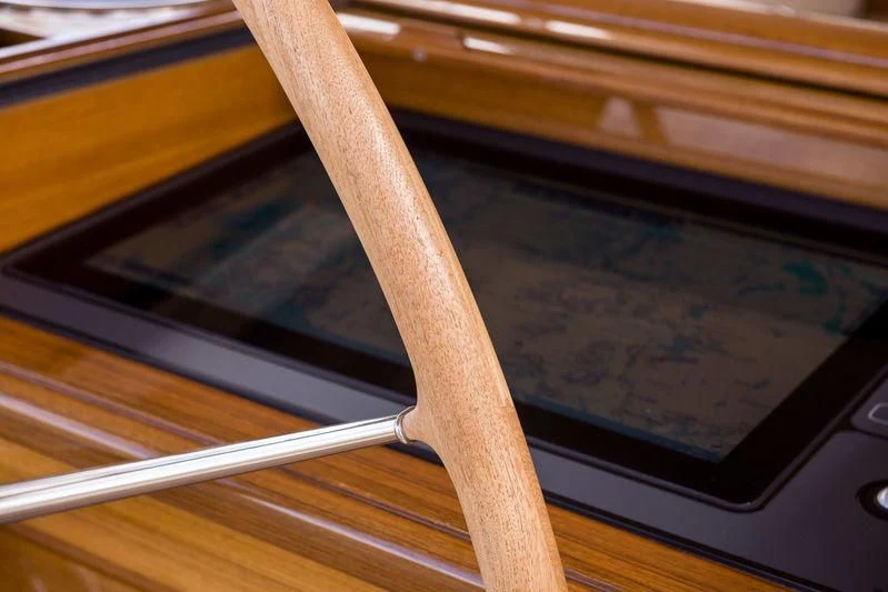 a wooden stick leaning against a window aboard WISP Yacht for Sale