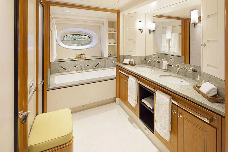 a bathroom with a sink and a mirror aboard WISP Yacht for Sale