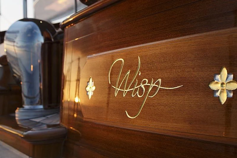 a wooden surface with a carved pumpkin and a candle on it aboard WISP Yacht for Sale