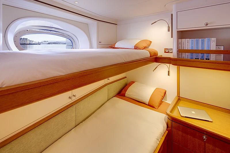 a room with a bed and a desk aboard WISP Yacht for Sale