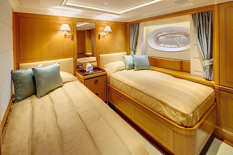 a hotel room with two beds aboard WISP Yacht for Sale