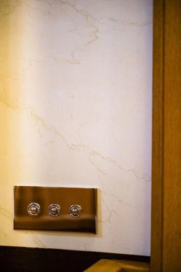a wall with a light switch aboard WISP Yacht for Sale