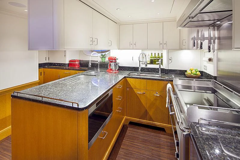 a kitchen with a large island aboard WISP Yacht for Sale