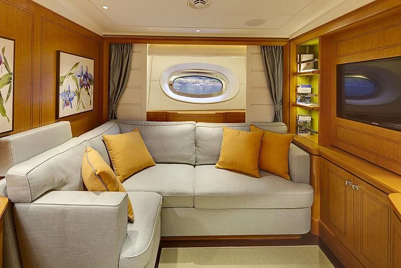 a living room with a couch and a tv aboard WISP Yacht for Sale