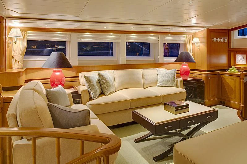 a living room with a couch and a coffee table aboard WISP Yacht for Sale