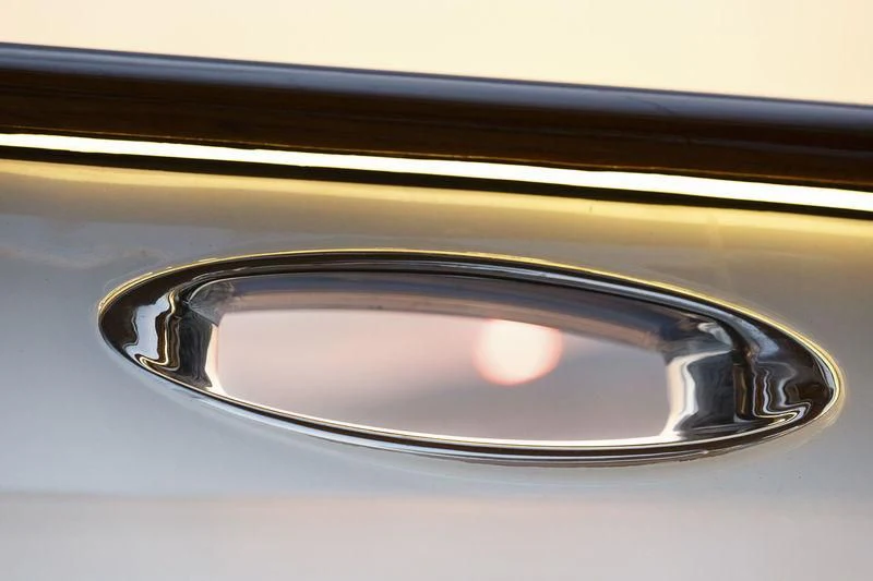 a close-up of a car's side view aboard WISP Yacht for Sale