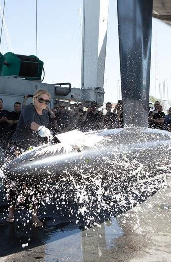 a person holding a white glove in water aboard BULLITT Yacht for Sale