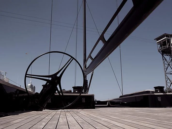 a large metal ship on a dock aboard BULLITT Yacht for Sale