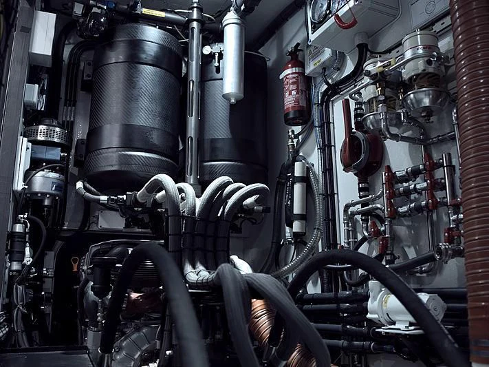 a machine with a large metal cylinder aboard BULLITT Yacht for Sale