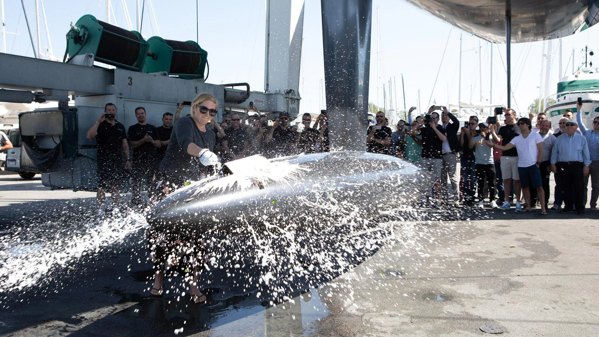 a group of people standing in water aboard BULLITT Yacht for Sale