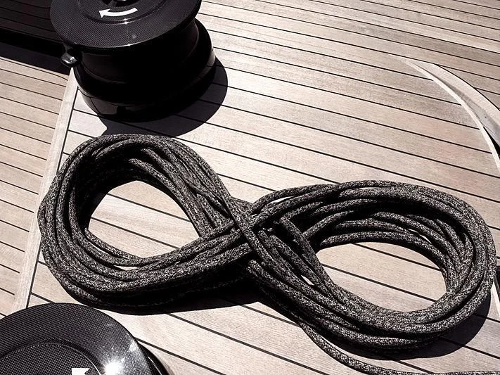 a pair of sunglasses on a wood surface aboard BULLITT Yacht for Sale