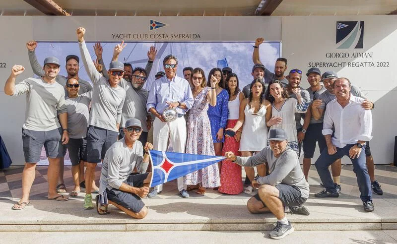 a group of people posing for a photo aboard BULLITT Yacht for Sale