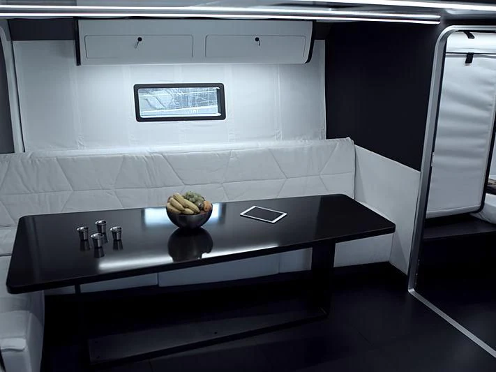 a black table with a bowl of fruit on it aboard BULLITT Yacht for Sale