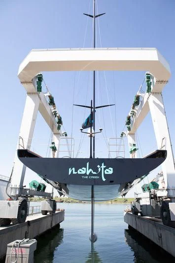 a large boat with a canopy aboard BULLITT Yacht for Sale