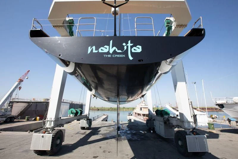 a large airplane on a trailer aboard BULLITT Yacht for Sale