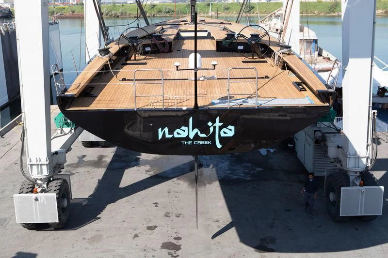 a large black boat on display aboard BULLITT Yacht for Sale