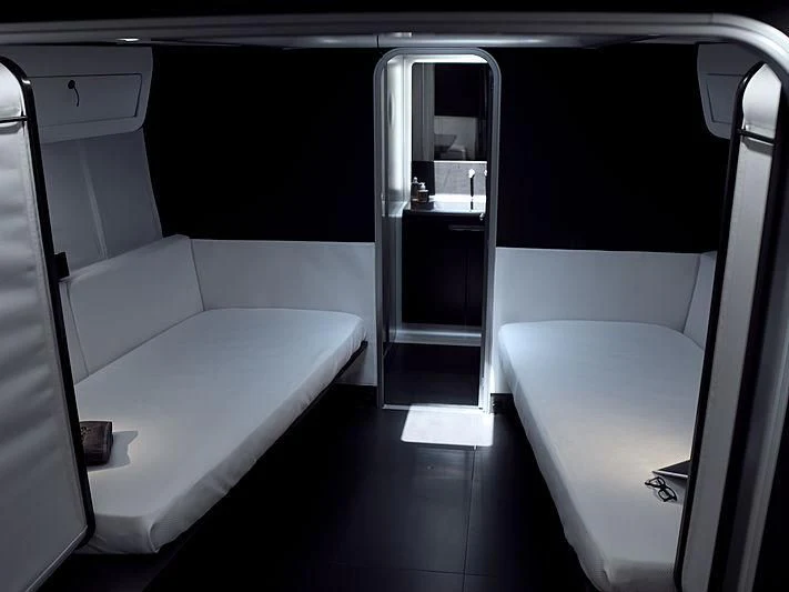 a room with a bed and a sink aboard BULLITT Yacht for Sale
