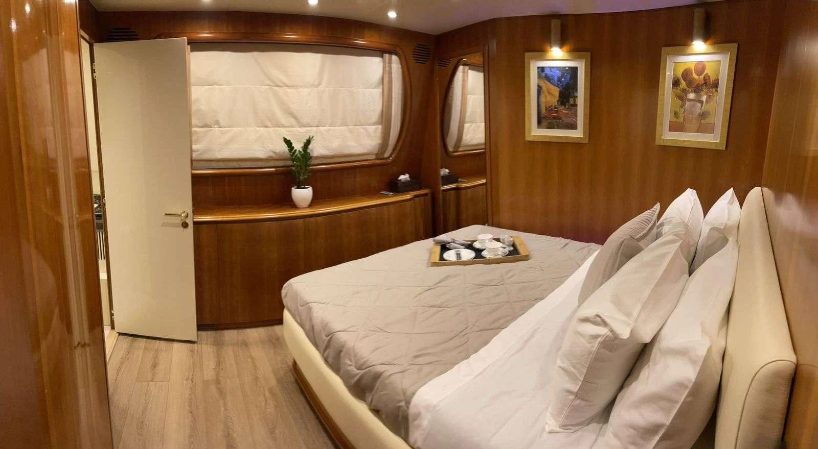 a bed in a room aboard ILLYA F Yacht for Charter