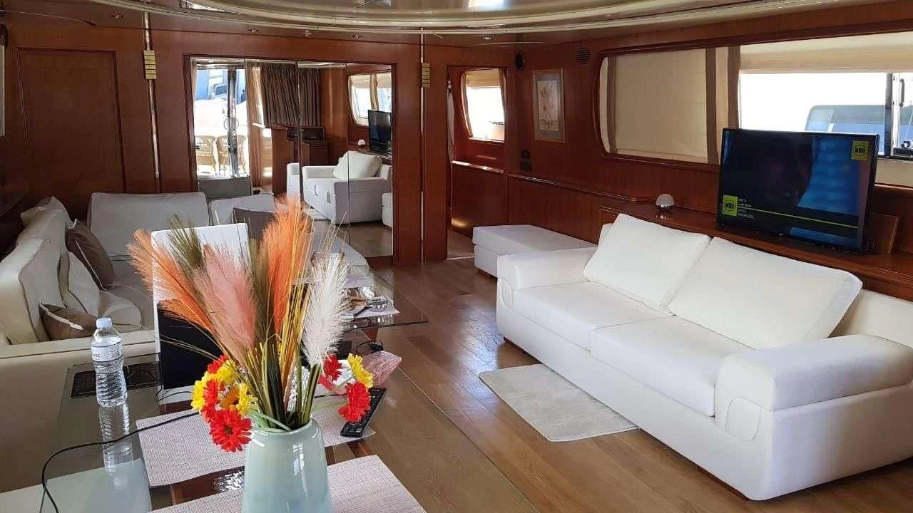 a living room with a large window aboard ILLYA F Yacht for Charter