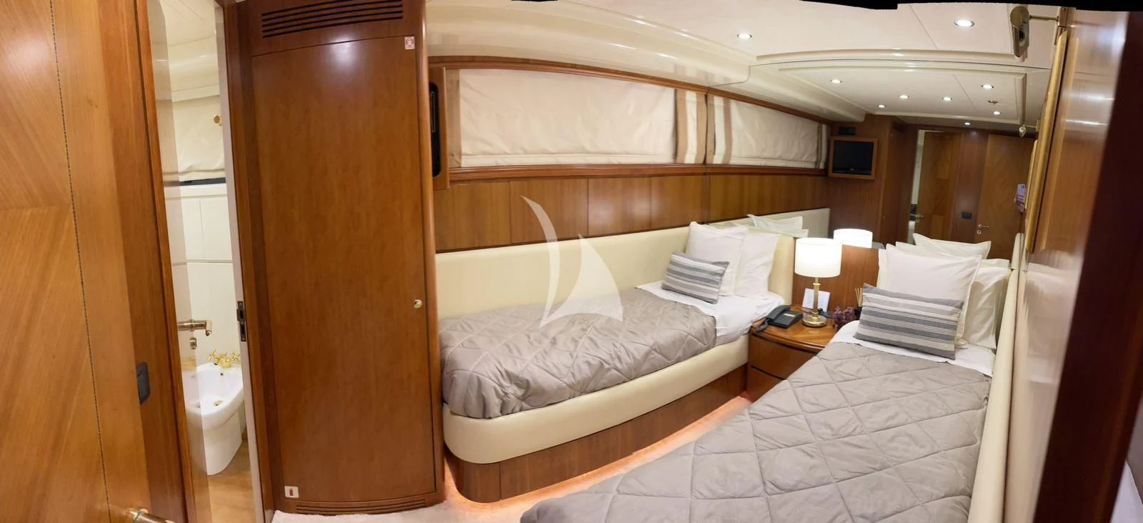 a room with a bed and a mirror aboard ILLYA F Yacht for Charter