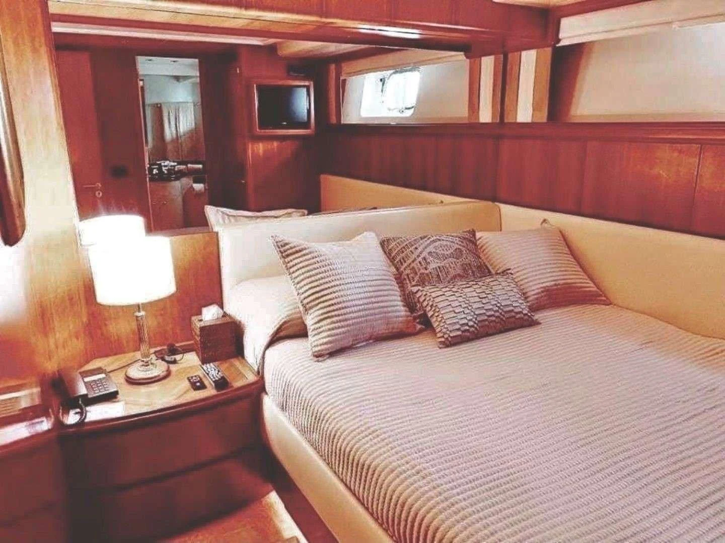 a bed with pillows aboard ILLYA F Yacht for Charter