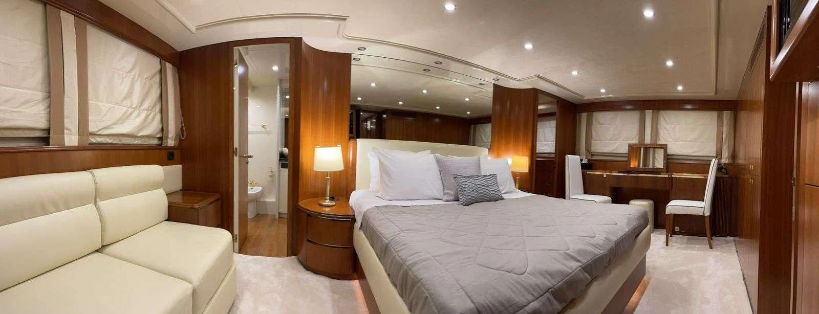 a room with a bed and a piano aboard ILLYA F Yacht for Charter