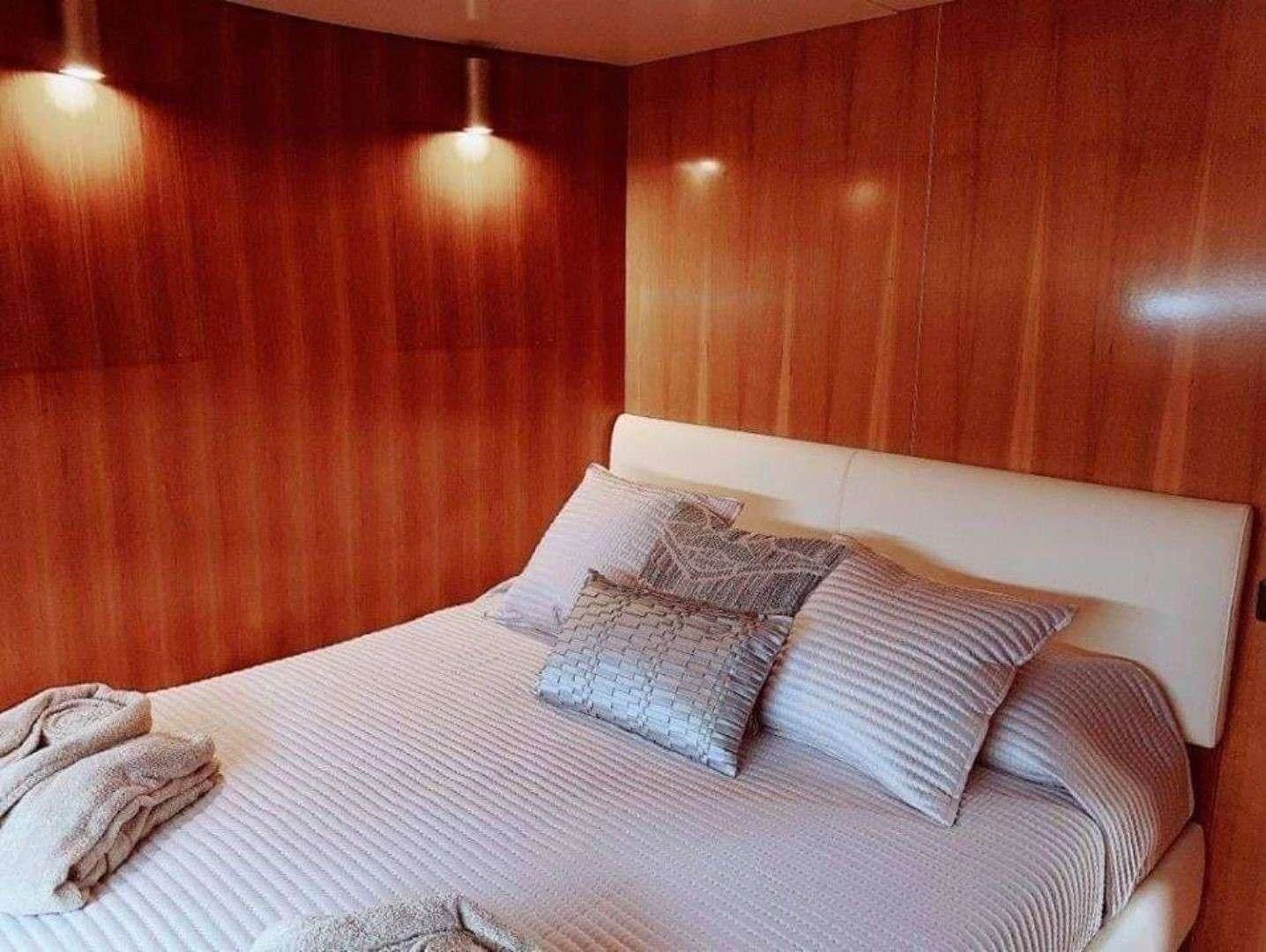 a bed with pillows aboard ILLYA F Yacht for Charter