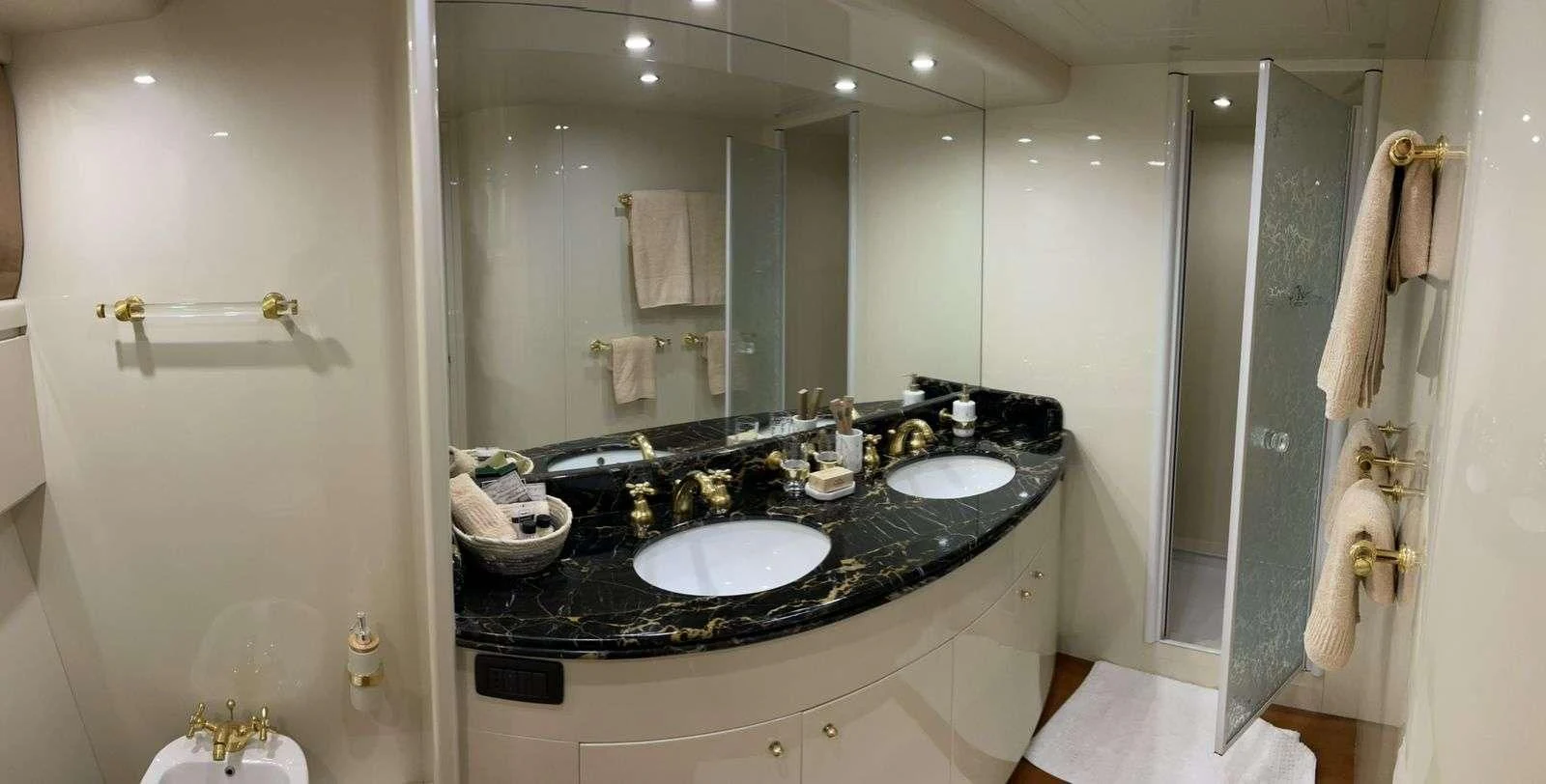 a bathroom with a large mirror aboard ILLYA F Yacht for Charter