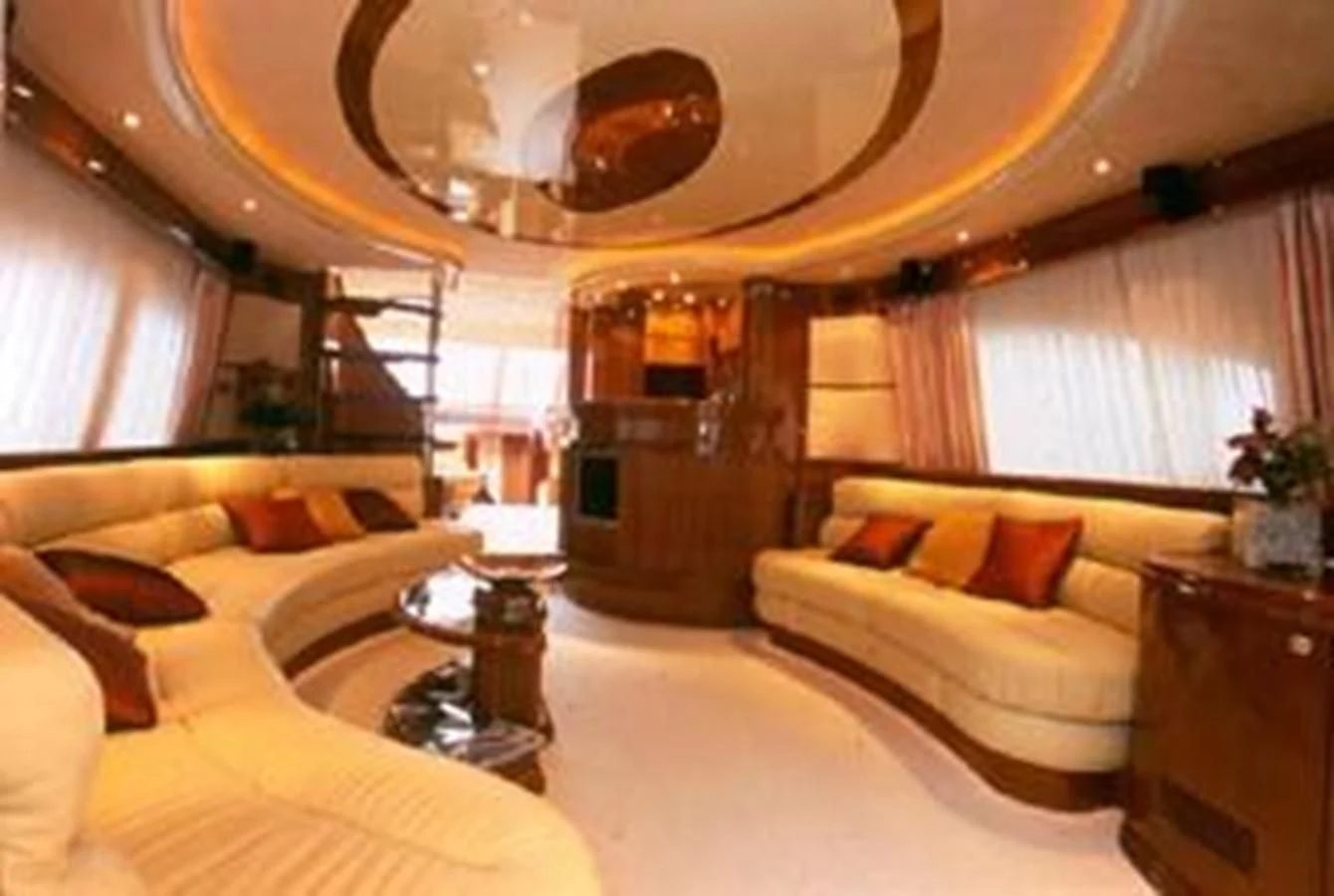a large room with a couch and a fireplace aboard AZIMUT 74 Yacht for Sale