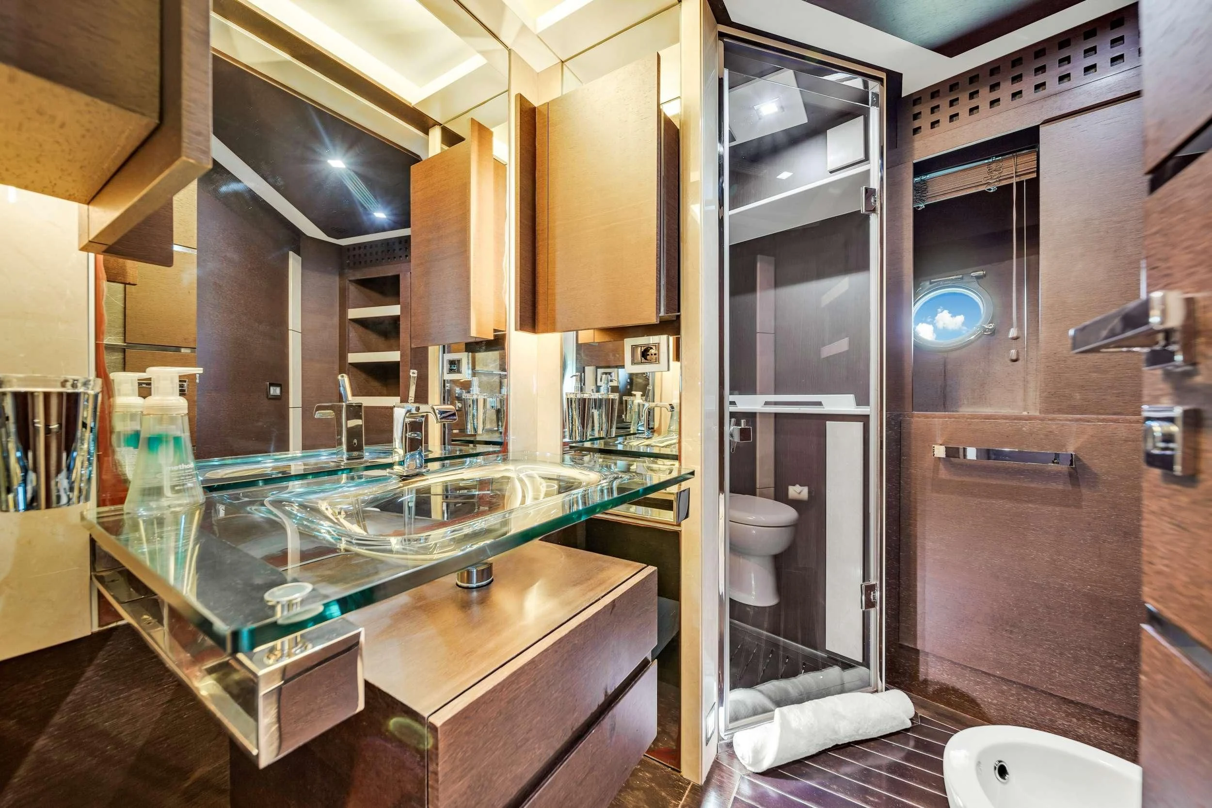 a bathroom with a large glass shower aboard SETTE Yacht for Sale