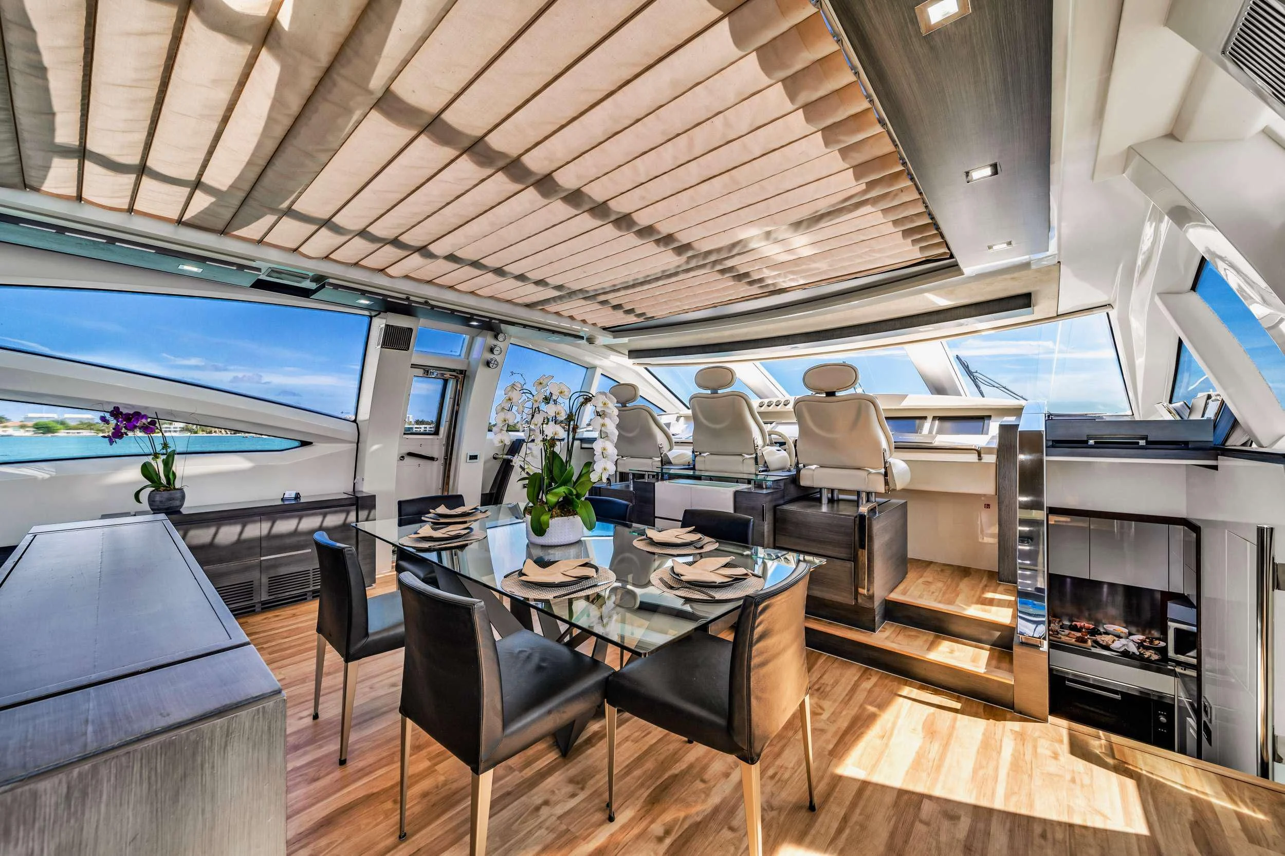 a large room with a table and chairs aboard SETTE Yacht for Sale