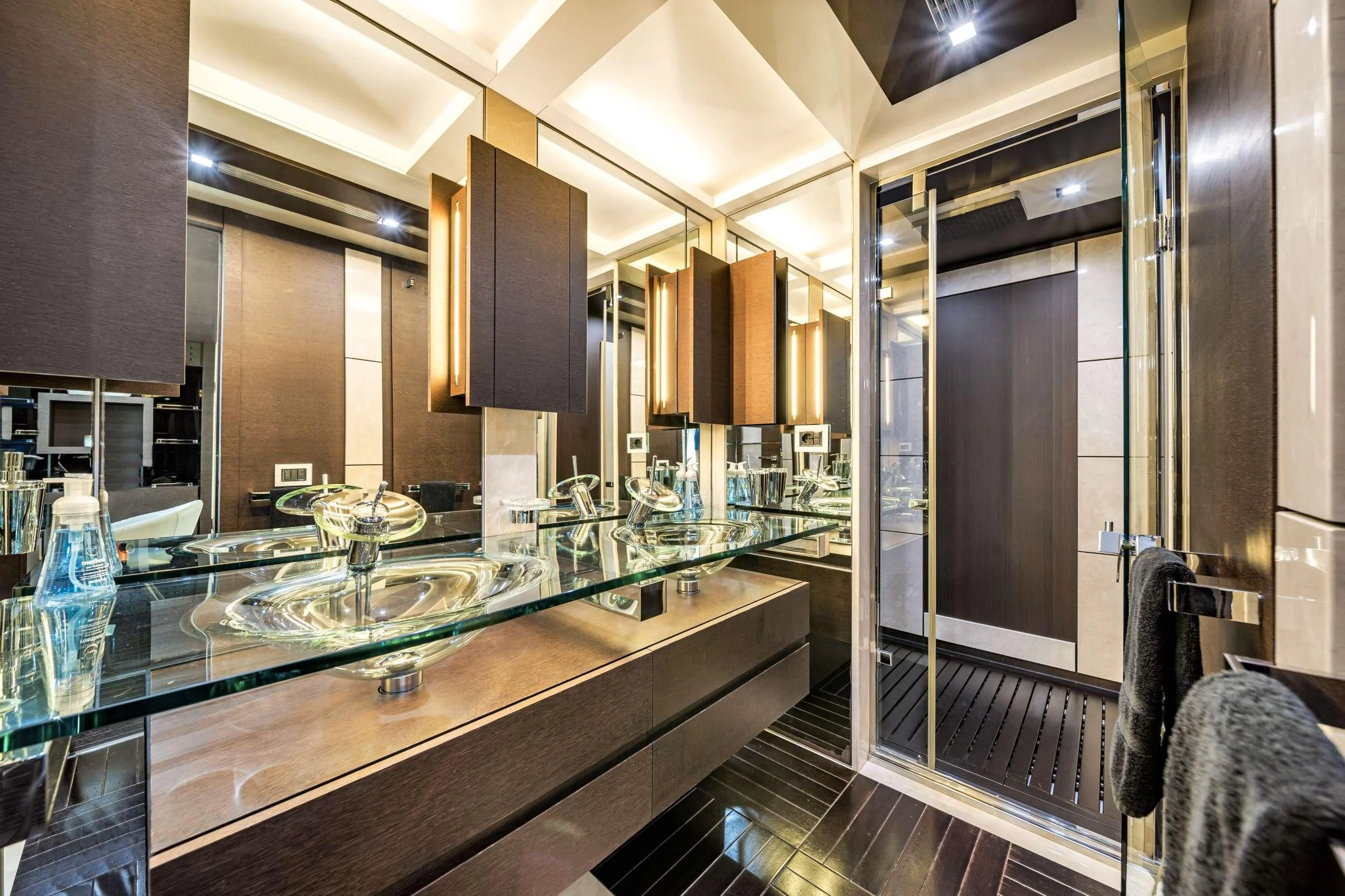 a large kitchen with glass sinks aboard SETTE Yacht for Sale