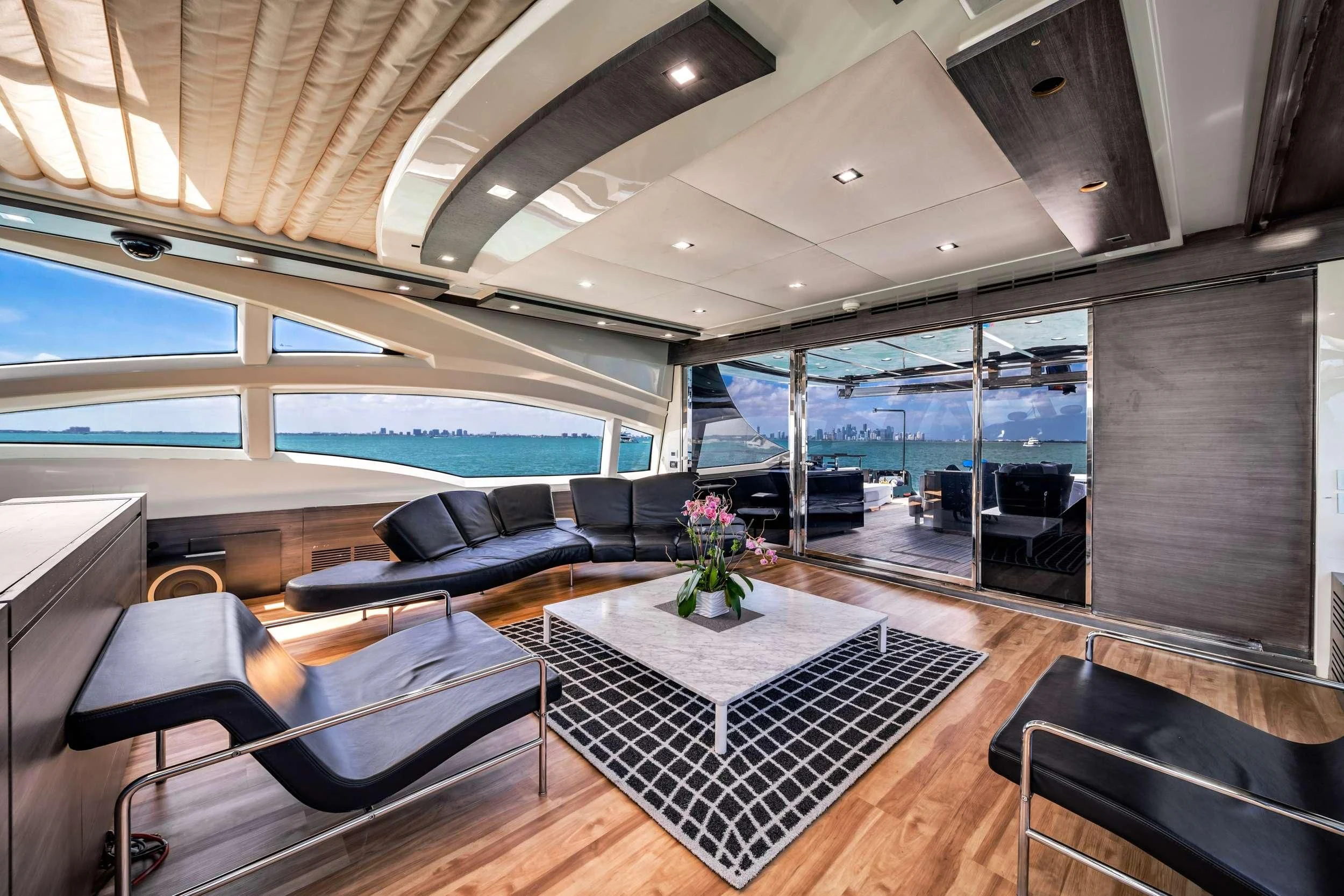 a room with a large glass wall and a large open window aboard SETTE Yacht for Sale