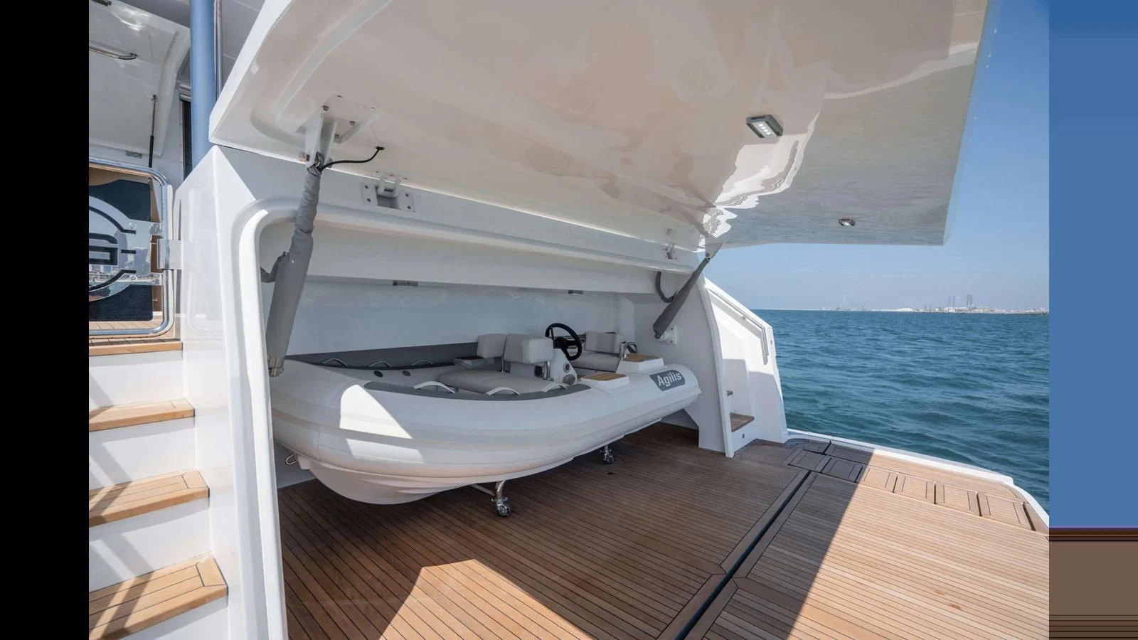 a boat with a sink and a large window aboard NOMAD 70 SUV Yacht for Sale