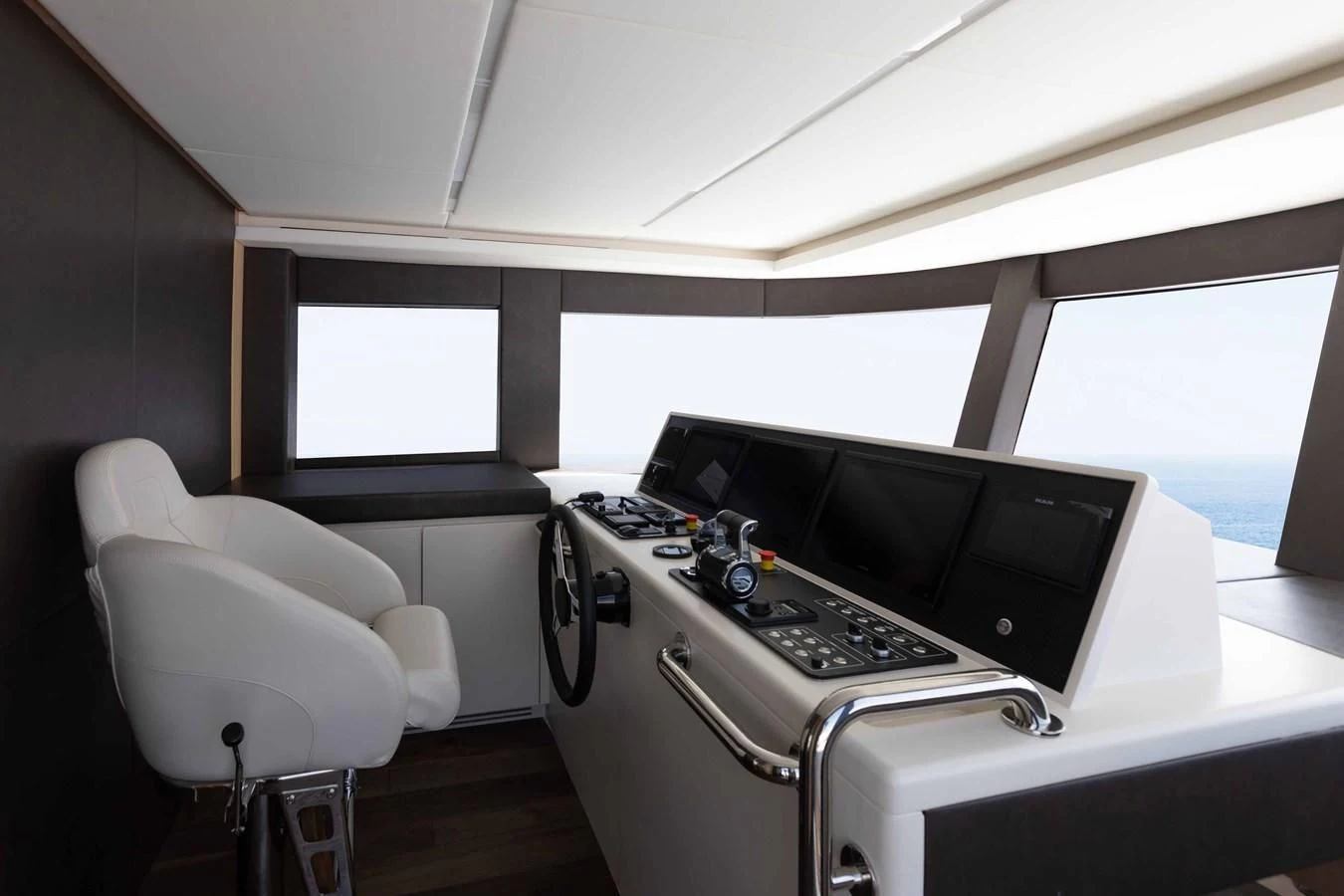 a room with a large television and a white chair aboard NOMAD 70 SUV Yacht for Sale