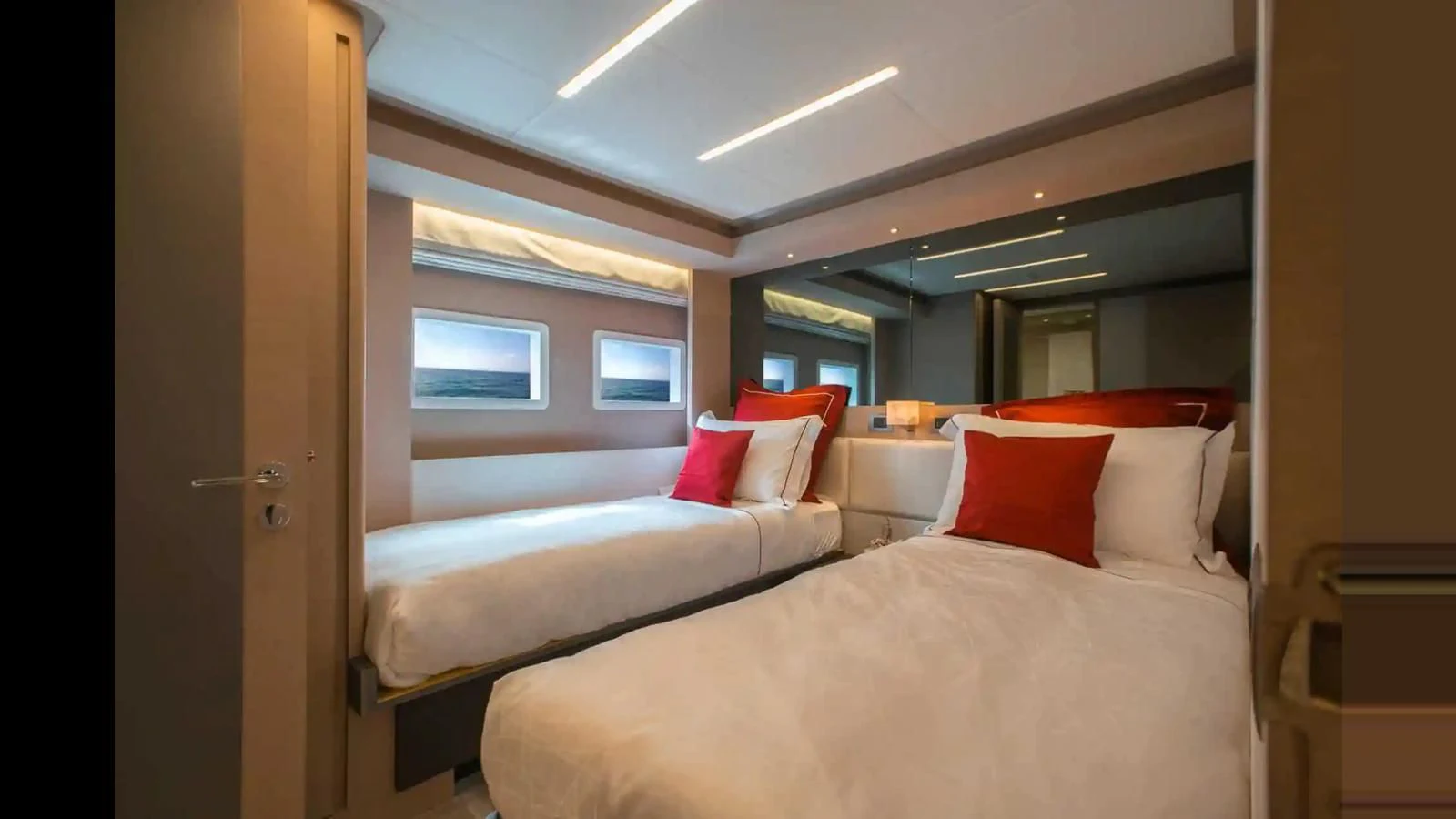 a room with two beds aboard NOMAD 70 SUV Yacht for Sale