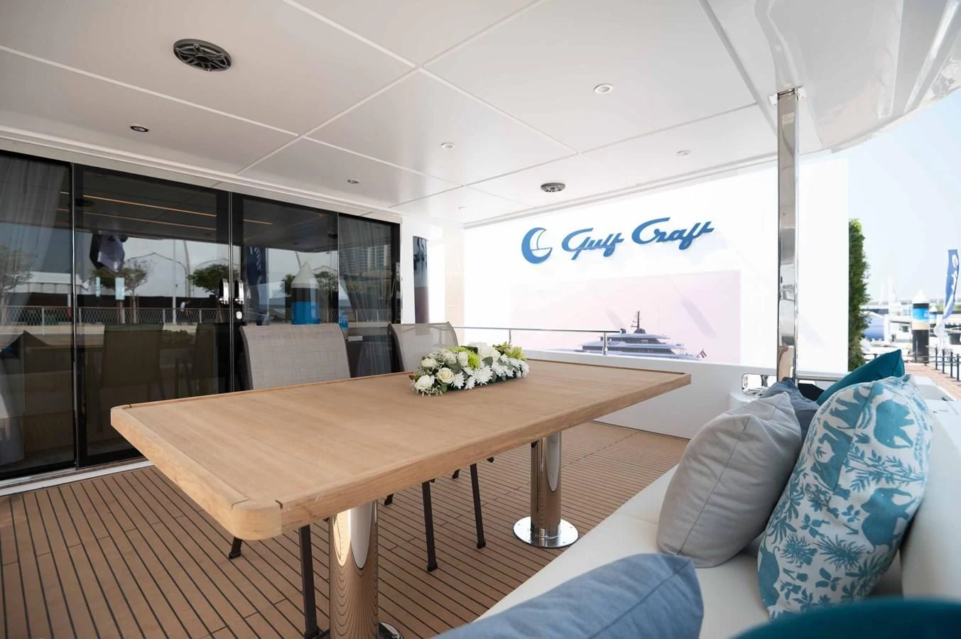 a room with a table and chairs aboard NOMAD 70 SUV Yacht for Sale