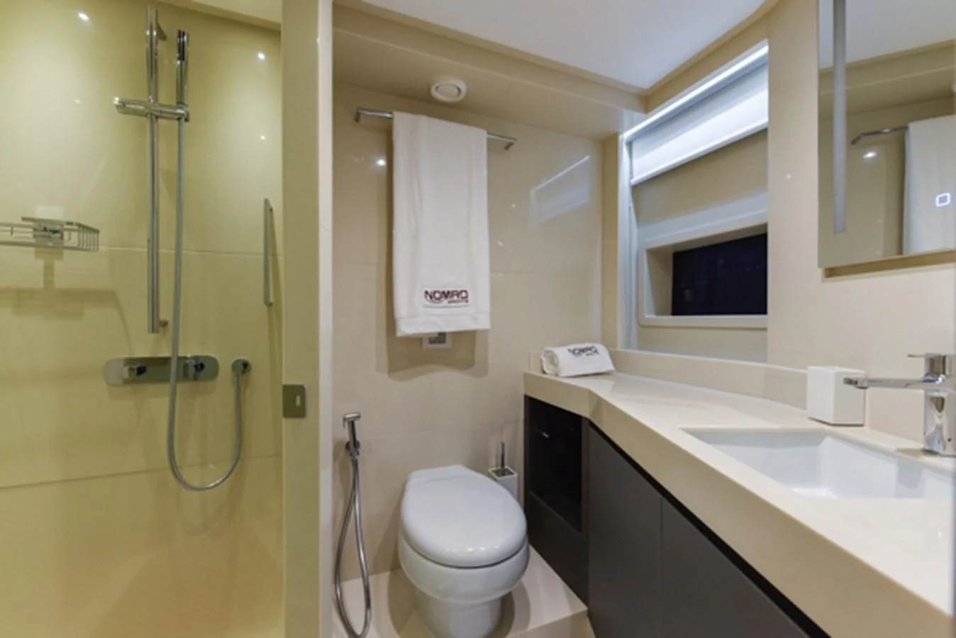 a bathroom with a glass shower aboard NOMAD 70 SUV Yacht for Sale