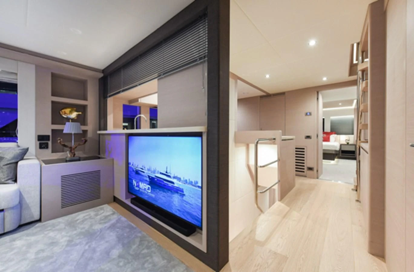 a bedroom with a tv and a bed aboard NOMAD 70 SUV Yacht for Sale