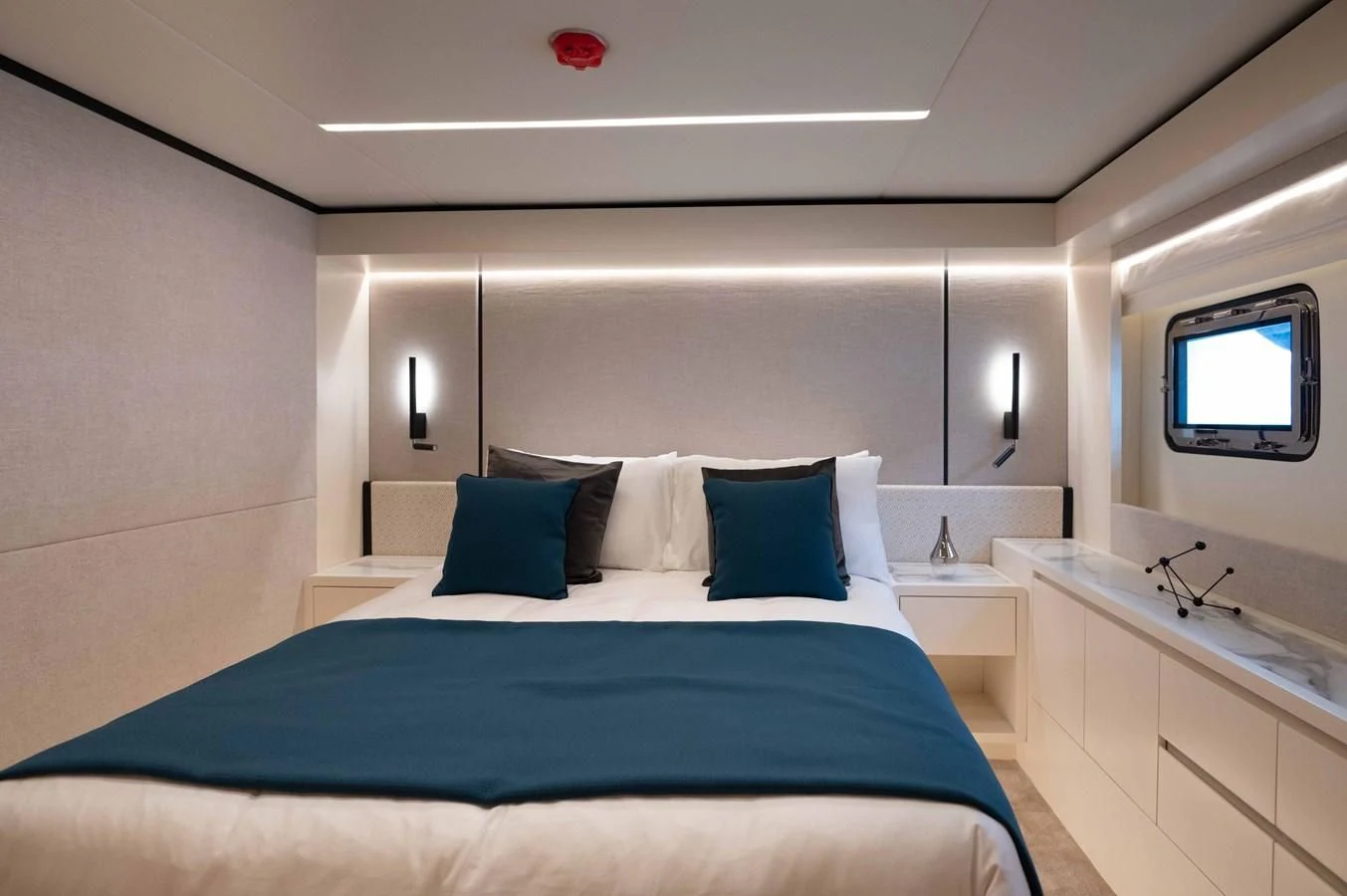 a bed in a room aboard NOMAD 70 SUV Yacht for Sale