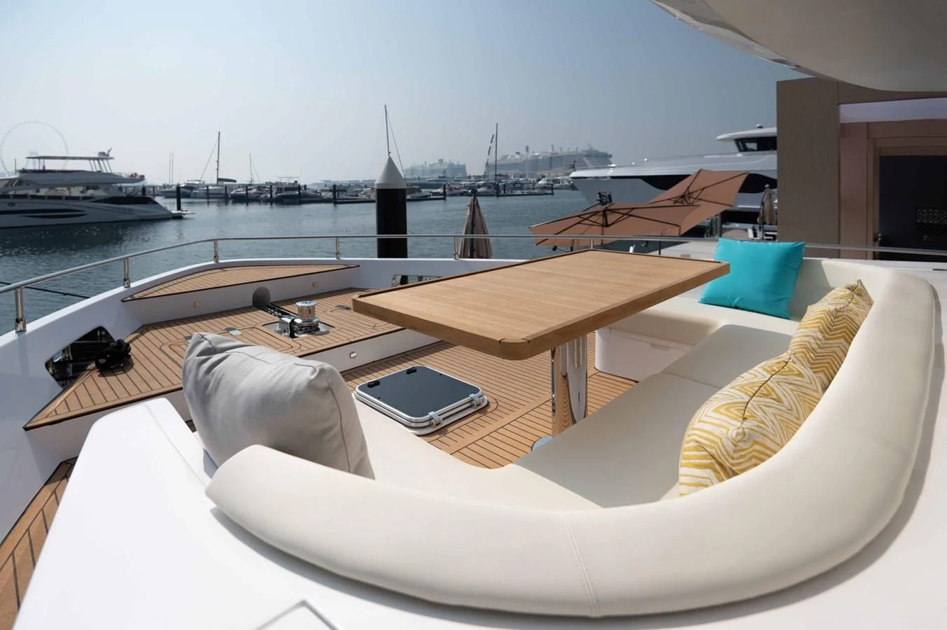 a room with a view of a city and a large body of water aboard NOMAD 70 SUV Yacht for Sale