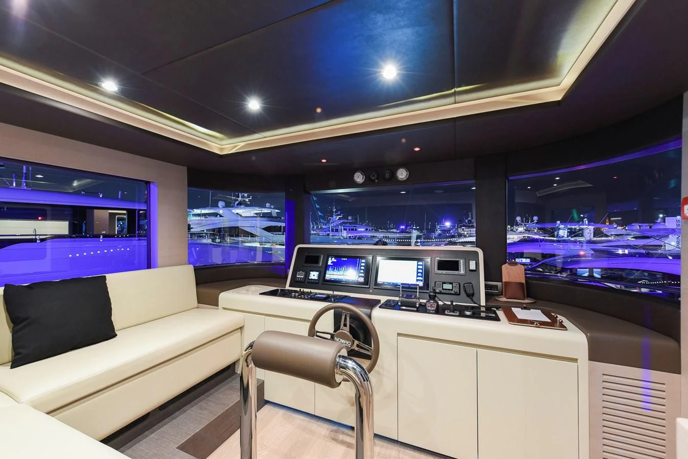 a room with a couch and a desk with a computer on it aboard NOMAD 70 SUV Yacht for Sale