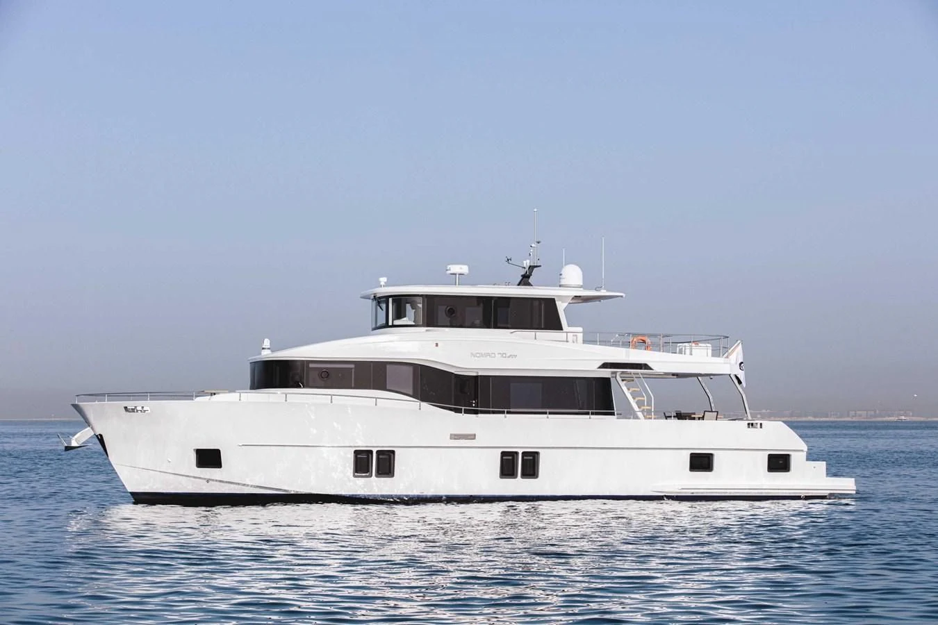 a large white boat aboard NOMAD 70 SUV Yacht for Sale