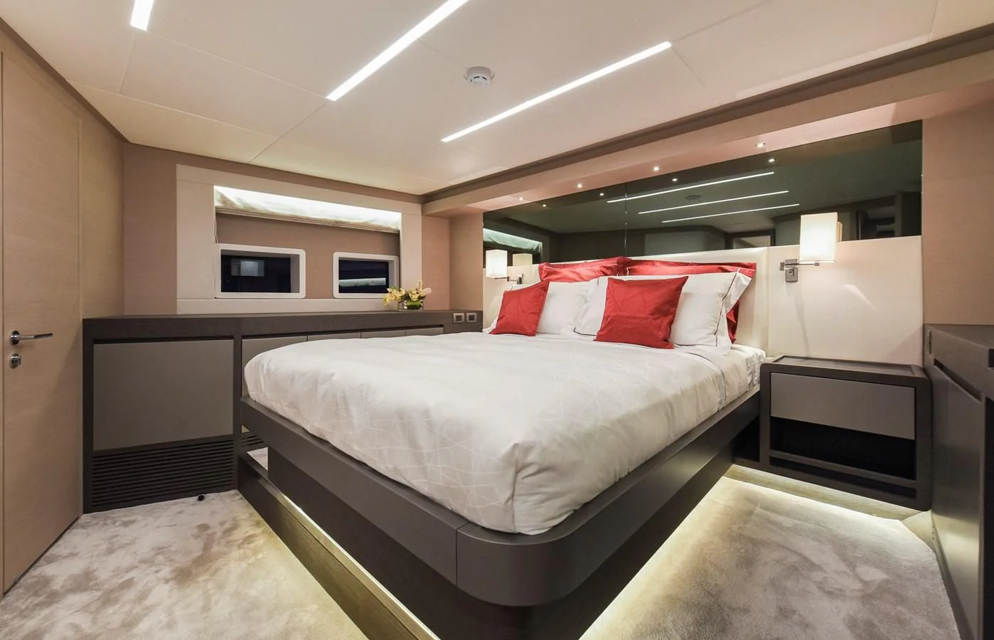 a room with a bed and a desk aboard NOMAD 70 SUV Yacht for Sale