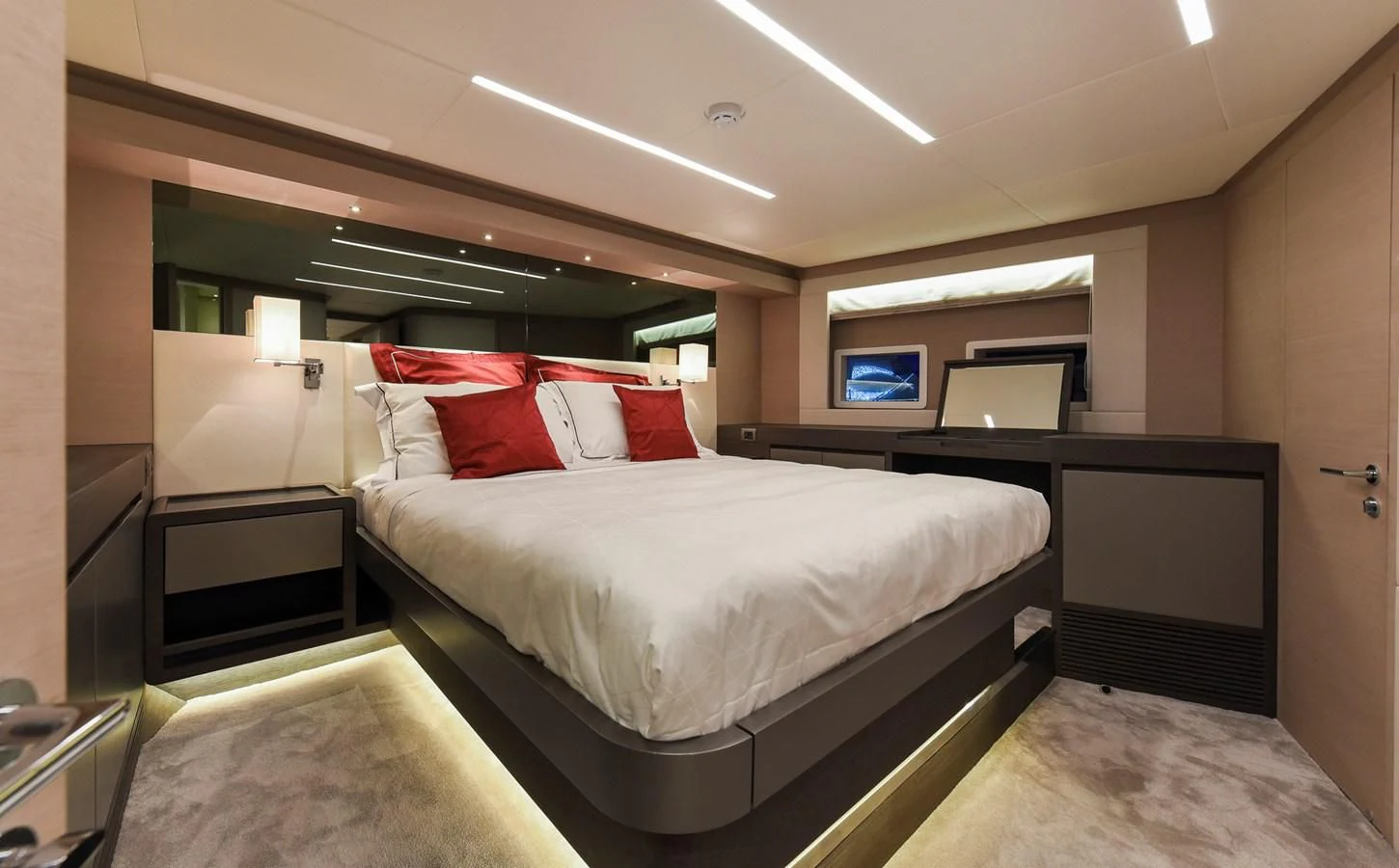 a room with a bed and a desk aboard NOMAD 70 SUV Yacht for Sale