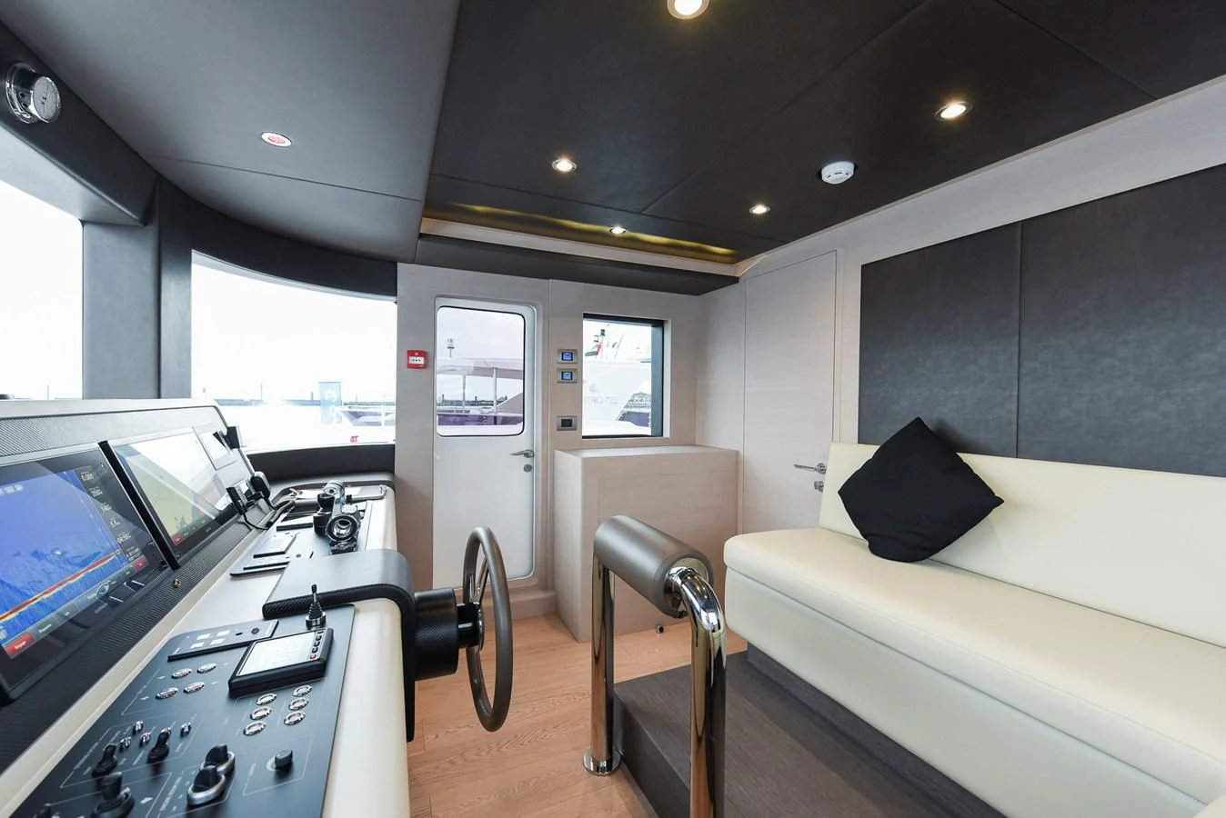 a room with a couch and a television aboard NOMAD 70 SUV Yacht for Sale