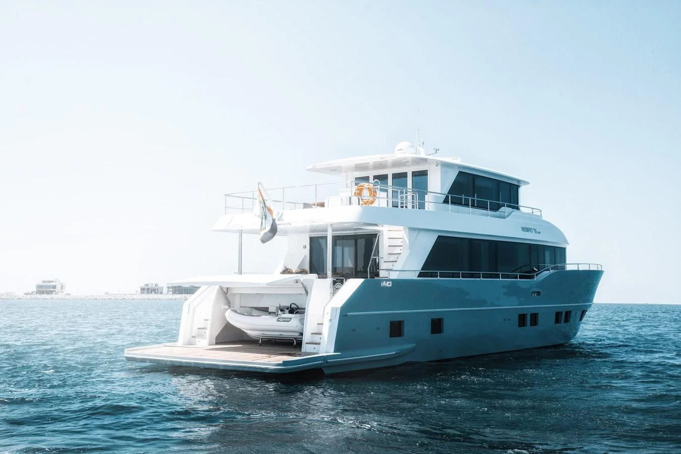 a boat on the water aboard NOMAD 70 SUV Yacht for Sale
